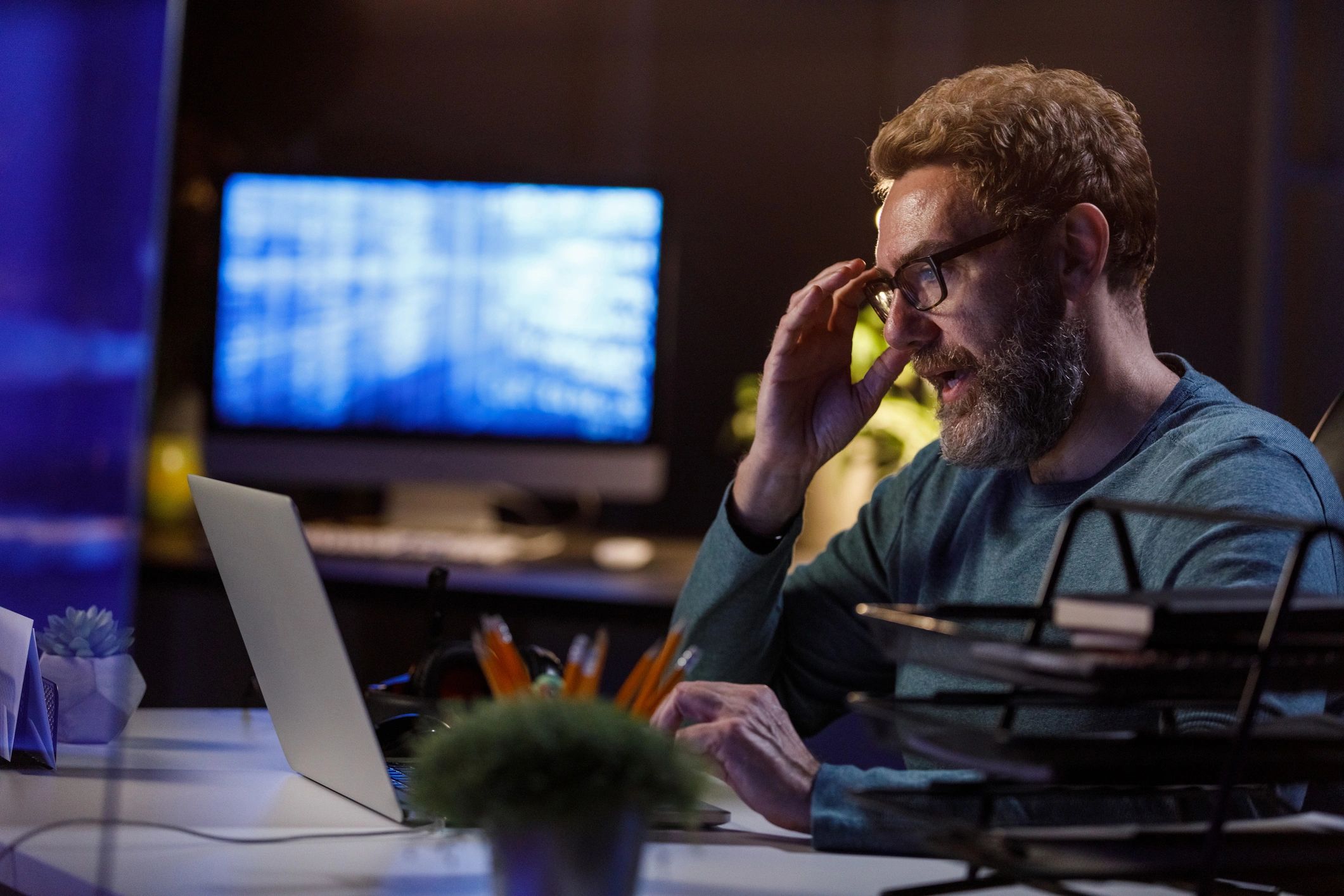 IT security specialist working late on a laptop