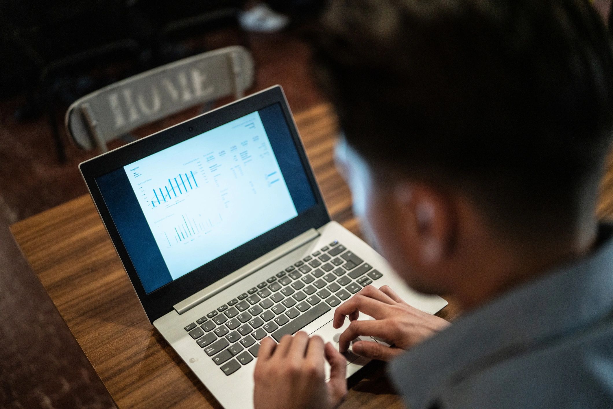 Cybersecurity professional working on a laptop