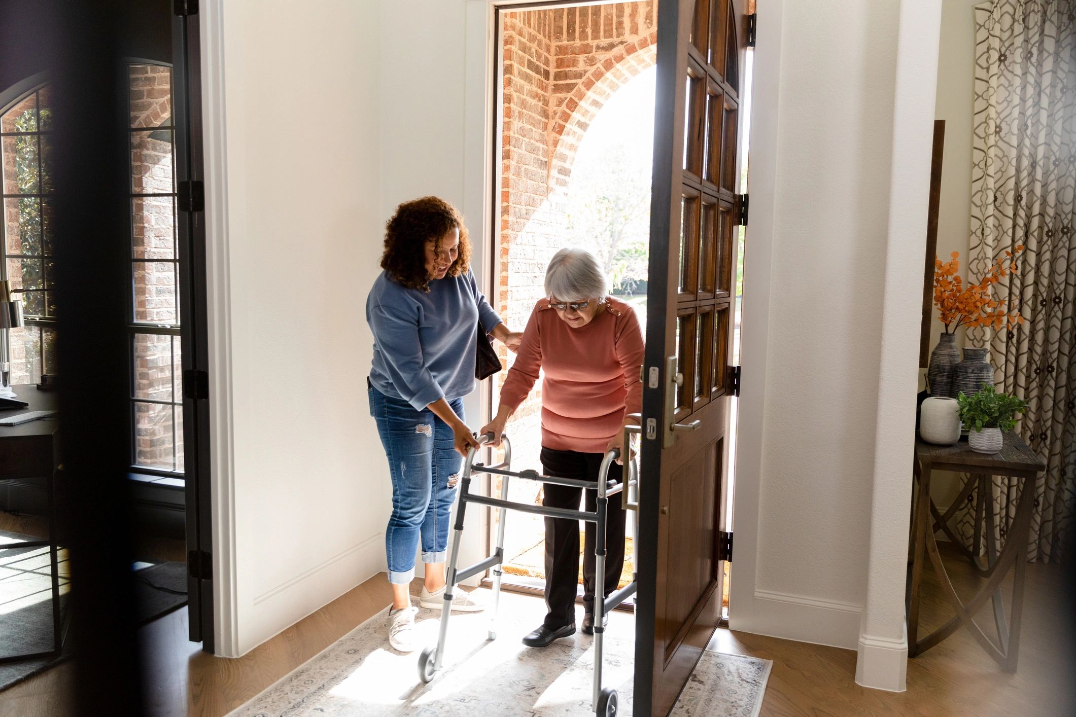 Caregiver assisting an older adult at home