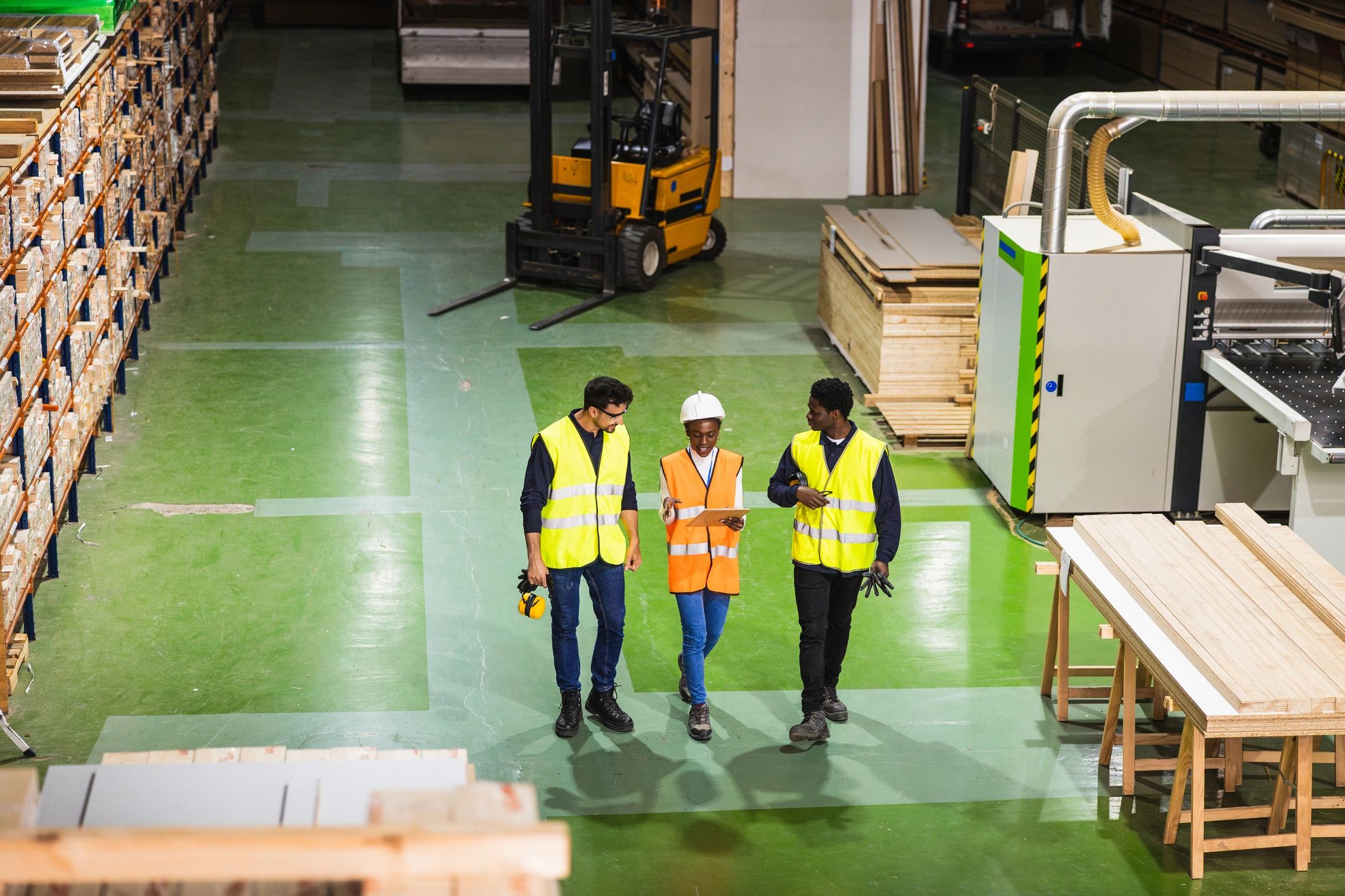 Logistics team walking through a warehouse yard