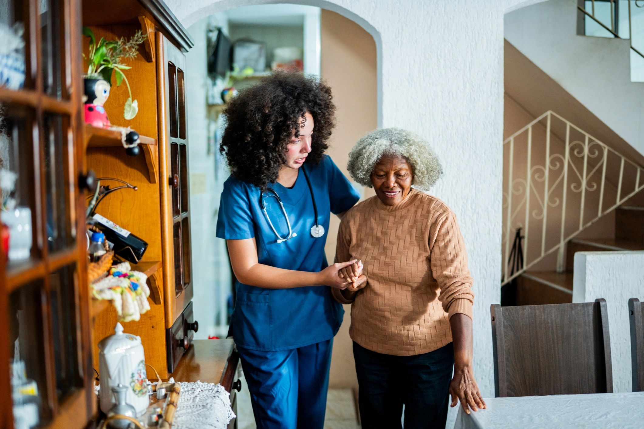 Caregiver supporting an elderly patient
