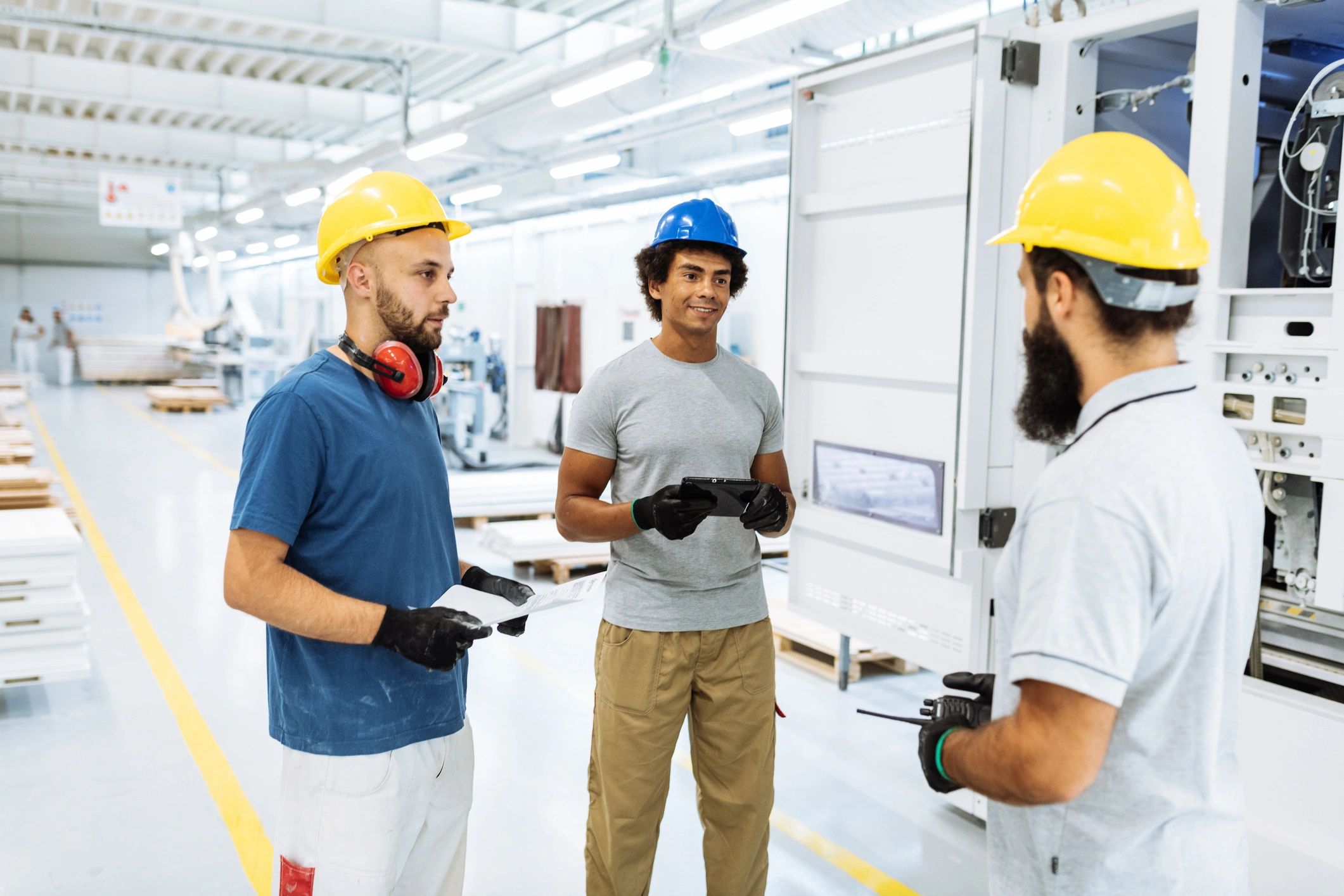 Experienced engineers and employees working in factory