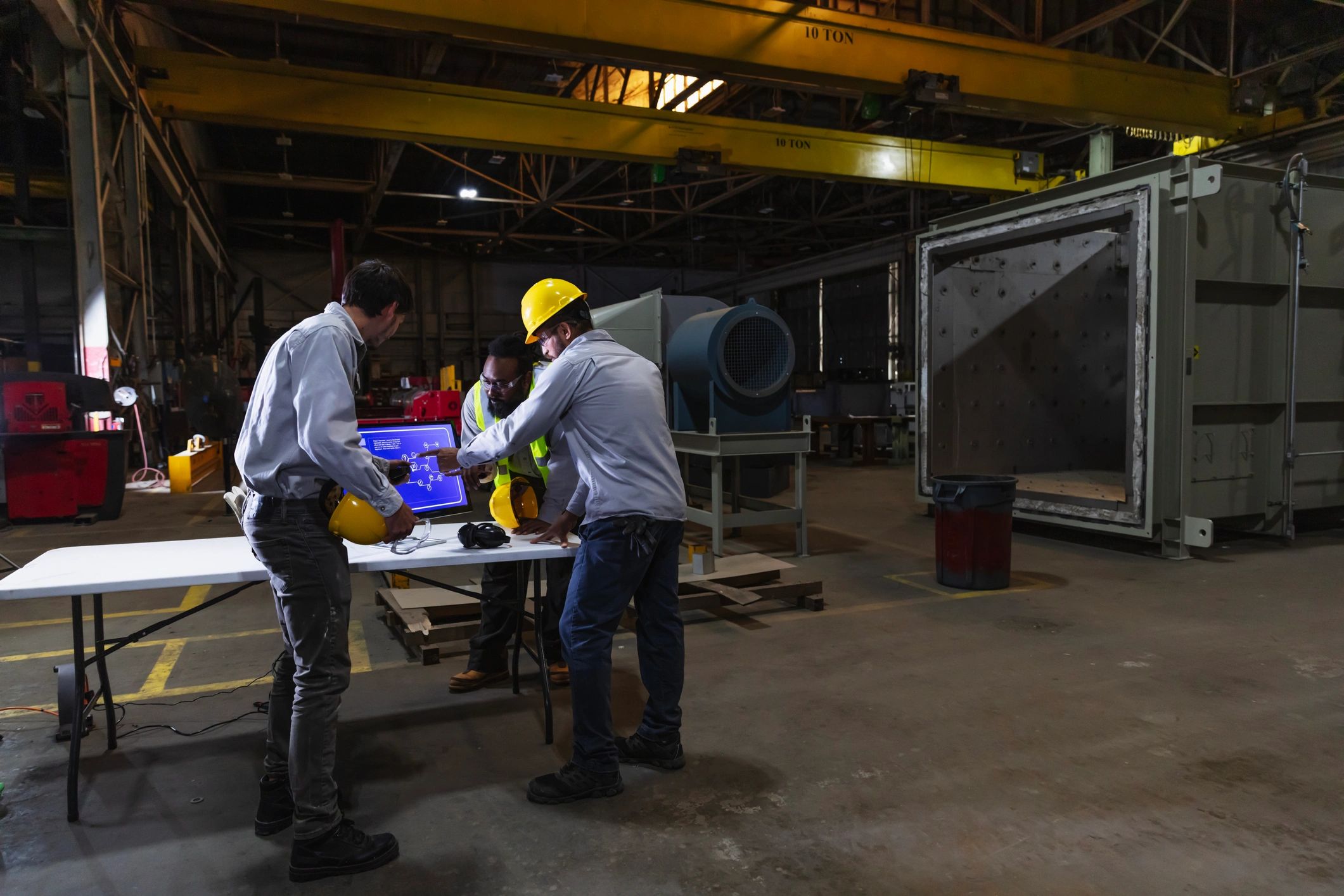 Manufacturing team collaborating on the factory floor